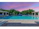 Inviting pool area with comfortable lounge chairs and lush greenery, ideal for leisure at 5300 S Atlantic Ave # 12-401, New Smyrna Beach, FL 32169