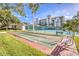 Shuffleboard courts are adjacent to the tennis courts and multi-story condos at 5300 S Atlantic Ave # 12-401, New Smyrna Beach, FL 32169