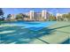 Bright blue tennis court available for use at 5300 S Atlantic Ave # 12-401, New Smyrna Beach, FL 32169