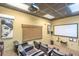 Community theater room with tiered seating, projector, and large screen at 5300 S Atlantic Ave # 12-401, New Smyrna Beach, FL 32169