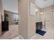 Bathroom entrance featuring a walk-in shower and vanity area at 5648 Nw 40Th Loop, Ocala, FL 34482