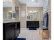 Bright bathroom with dual vanities, granite countertops, and glass-enclosed shower at 5648 Nw 40Th Loop, Ocala, FL 34482
