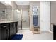 Elegant bathroom featuring a glass-enclosed shower and a granite-topped vanity at 5648 Nw 40Th Loop, Ocala, FL 34482