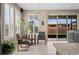 Bright breakfast nook with plantation shutters, modern lighting, and sliding glass doors to the backyard at 5648 Nw 40Th Loop, Ocala, FL 34482