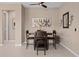 Inviting dining area with wine-themed decor, ceiling fan, and neutral color scheme at 5648 Nw 40Th Loop, Ocala, FL 34482
