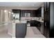 Well-equipped kitchen with stainless steel appliances, dark wood cabinets, and a convenient island at 5648 Nw 40Th Loop, Ocala, FL 34482