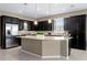 Modern kitchen with stainless steel appliances, granite countertops, and ample cabinet space at 5648 Nw 40Th Loop, Ocala, FL 34482
