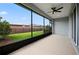 Covered patio features ceiling fan and great views of the backyard at 5648 Nw 40Th Loop, Ocala, FL 34482