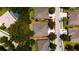 An aerial view of the property showing its roof, landscaping, and surrounding neighborhood at 565 Morgan Wood Dr, Deland, FL 32724