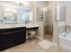 Elegant bathroom featuring a shower, tub, and vanity at 565 Morgan Wood Dr, Deland, FL 32724