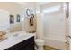 Bright bathroom featuring a single sink vanity, and a shower-tub combo with a white shower curtain at 565 Morgan Wood Dr, Deland, FL 32724