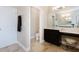 Bathroom featuring vanity with makeup counter, toilet area, and walk-in closet at 565 Morgan Wood Dr, Deland, FL 32724