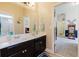 Bright bathroom featuring double sinks, stylish cabinetry, and modern fixtures at 565 Morgan Wood Dr, Deland, FL 32724