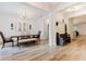 Bright dining room features wood floors, neutral walls, a wooden table and connected to the entryway at 565 Morgan Wood Dr, Deland, FL 32724