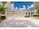 Charming single-Gathering home with a well-maintained lawn and a spacious three-car driveway at 565 Morgan Wood Dr, Deland, FL 32724