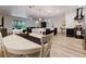 Open-concept kitchen with an island, modern appliances, and dining area at 565 Morgan Wood Dr, Deland, FL 32724
