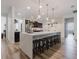 Spacious kitchen featuring island seating, modern countertops, and pendant lights at 565 Morgan Wood Dr, Deland, FL 32724