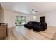 Open living room with wood floors and sliding glass doors leading to the patio at 565 Morgan Wood Dr, Deland, FL 32724