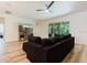 Bright and airy living room with wood flooring and a view of the outdoors at 565 Morgan Wood Dr, Deland, FL 32724
