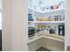 Organized walk-in pantry with wooden countertops and shelving at 565 Morgan Wood Dr, Deland, FL 32724