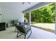 Inviting covered patio with comfortable seating and outdoor cooking area at 565 Morgan Wood Dr, Deland, FL 32724