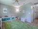 This bedroom features hardwood floors, neutral walls, and a play area at 5936 Boggs Ford Rd, Port Orange, FL 32127