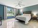 Relaxing bedroom with nice window views, stylish decor, and natural light at 5936 Boggs Ford Rd, Port Orange, FL 32127