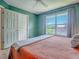 Bedroom with a large window offering an inviting space and a view of the trees outside at 5936 Boggs Ford Rd, Port Orange, FL 32127