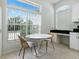 Sunny dining area boasts large window views, a modern table set, and stylish decor for comfortable living at 5936 Boggs Ford Rd, Port Orange, FL 32127