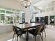 Modern dining room featuring a chandelier and lots of natural light at 5936 Boggs Ford Rd, Port Orange, FL 32127