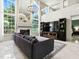 Bright living room with large windows, a fireplace, and a television at 5936 Boggs Ford Rd, Port Orange, FL 32127