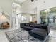 Spacious living room with modern furniture, large windows, and high ceilings at 5936 Boggs Ford Rd, Port Orange, FL 32127