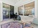 Relaxing sunroom with large windows providing plenty of natural light and views of chandeliers at 5936 Boggs Ford Rd, Port Orange, FL 32127