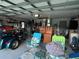 Spacious garage featuring motorcycle, tools, and organization at 6211 Oak River Ter, Port Orange, FL 32127
