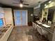 Eat-in kitchen features tile floors, a breakfast bar and view of the outdoor area at 6211 Oak River Ter, Port Orange, FL 32127