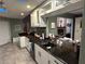 Modern kitchen featuring granite countertops and stainless steel appliances at 6211 Oak River Ter, Port Orange, FL 32127