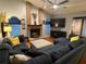 Cozy living room features a brick fireplace, vaulted ceiling and ceiling fan at 6211 Oak River Ter, Port Orange, FL 32127