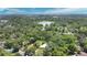 Panoramic aerial view showcasing lush greenery, serene lake, and a picturesque cityscape on the horizon at 626 Cannon St, Daytona Beach, FL 32114