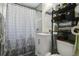 A clean and functional bathroom featuring modern fixtures, a shower, and ample storage space at 626 Cannon St, Daytona Beach, FL 32114