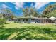 A charming single-story home with a well-maintained lawn and mature trees, in a serene setting at 626 Cannon St, Daytona Beach, FL 32114