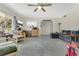 Inviting living room with tile flooring, stylish seating, and a mounted TV, perfect for relaxation and entertainment at 626 Cannon St, Daytona Beach, FL 32114
