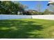 Expansive backyard enclosed by a pristine white fence, perfect for recreation at 1693 Arash Cir, Port Orange, FL 32128