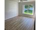 Bright bedroom with a large window offering backyard views at 1693 Arash Cir, Port Orange, FL 32128