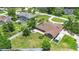 Aerial view of a well-maintained property with a large backyard, patio, lush landscaping, and a privacy fence at 202 Yorkville Pl, Debary, FL 32713