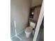 Bathroom showcasing marble floors, a wooden cabinet, and standard toilet fixture at 202 Yorkville Pl, Debary, FL 32713