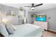 Relaxing bedroom featuring a bed, dresser and a window with lots of natural light at 202 Yorkville Pl, Debary, FL 32713