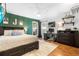 Nicely decorated bedroom featuring a bed, and a workstation with natural lighting at 202 Yorkville Pl, Debary, FL 32713