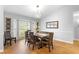 Elegant dining room featuring a modern chandelier and a large window for ample natural light at 202 Yorkville Pl, Debary, FL 32713