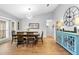 Dining room featuring chandelier, large window, and light grey walls at 202 Yorkville Pl, Debary, FL 32713