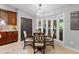 Bright kitchen nook with a cozy breakfast table, large windows, and ample natural light at 202 Yorkville Pl, Debary, FL 32713